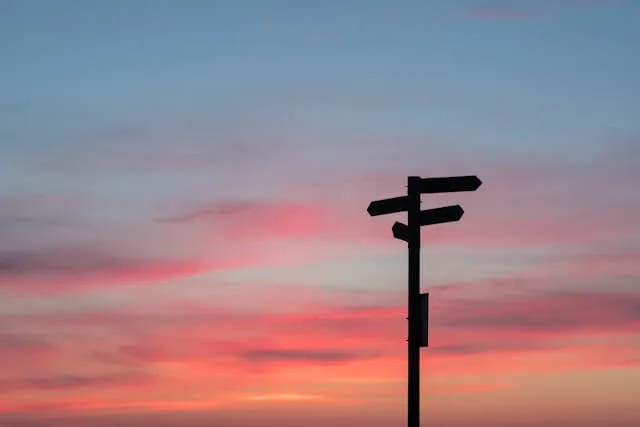 A sunset with a sign